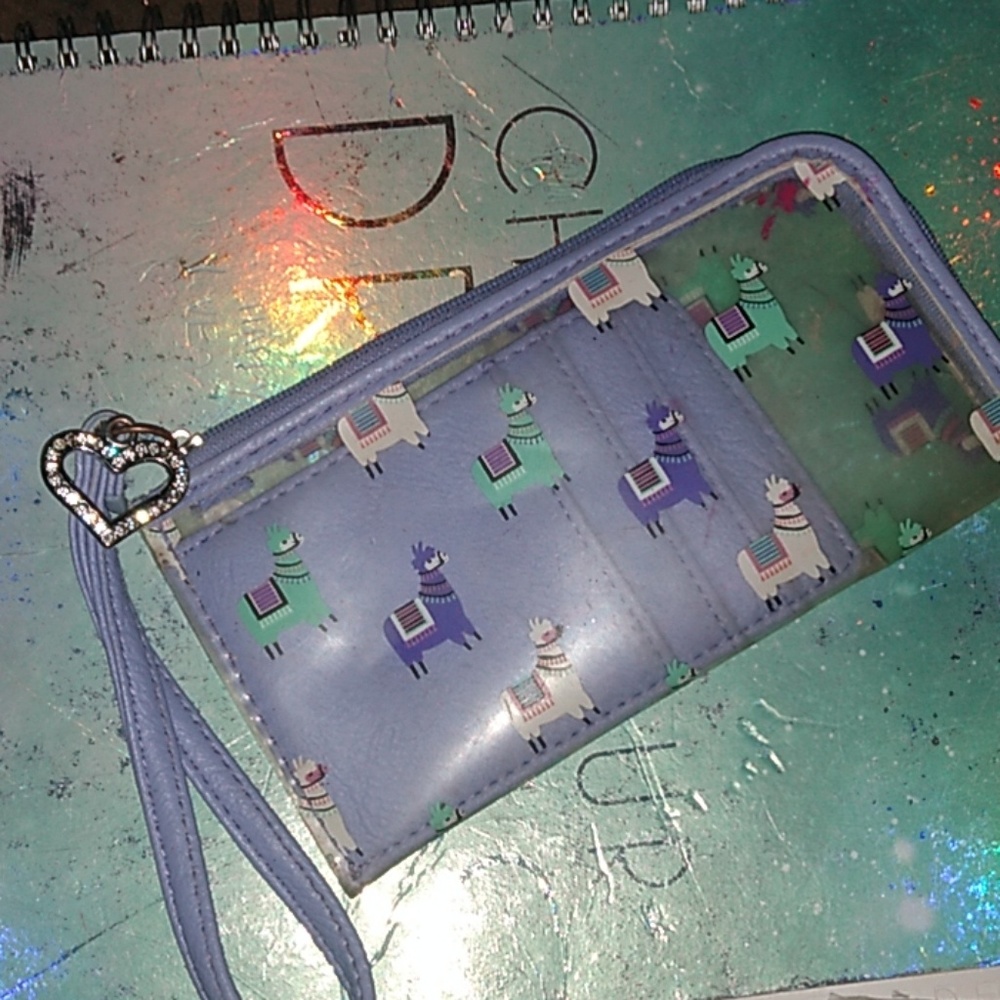 Used but GC purple llama wrist wallet
